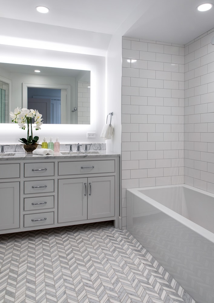 Bathroom vanity and bathtub in a Hamptons boathouse designed by Annette Jaffe
