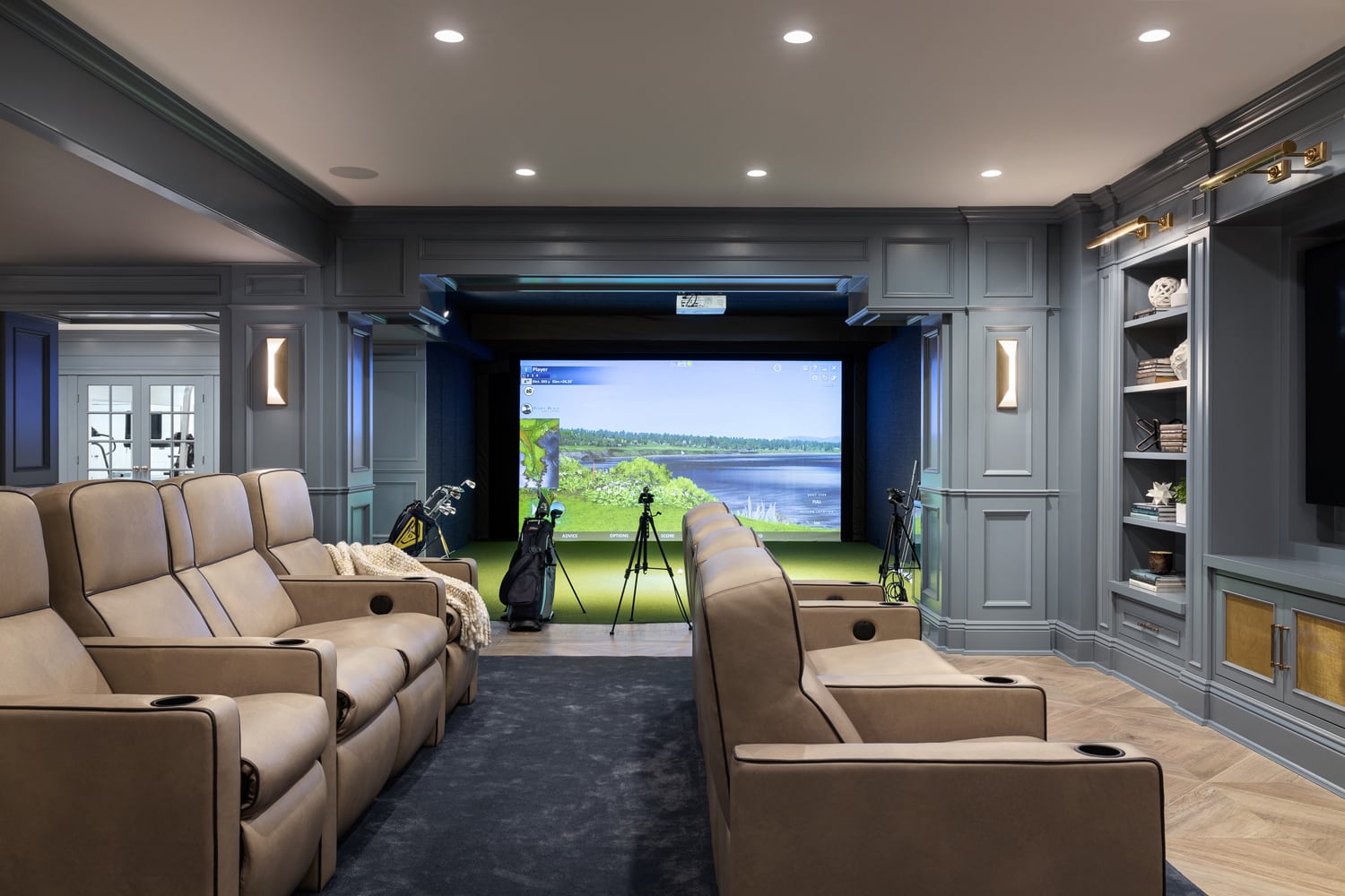 Sands Point basement golf simulator and media room design by Annette Jaffe Interiors
