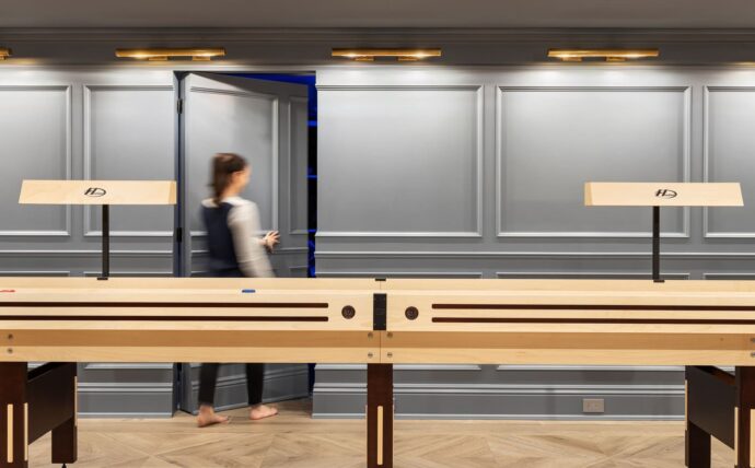 Shuffleboard in a Sands Point basement home designed by Annette Jaffe Interiors